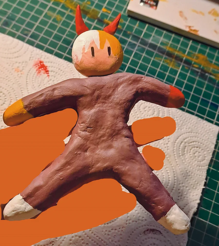 photo of a censored out hand holding a mayo. the mayo is made out of clay and painted, and has a very cartoonish and blob-like style, similar to that of the teto present in the igaku video